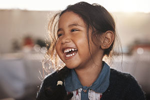 happy child laughing, get more adoption information